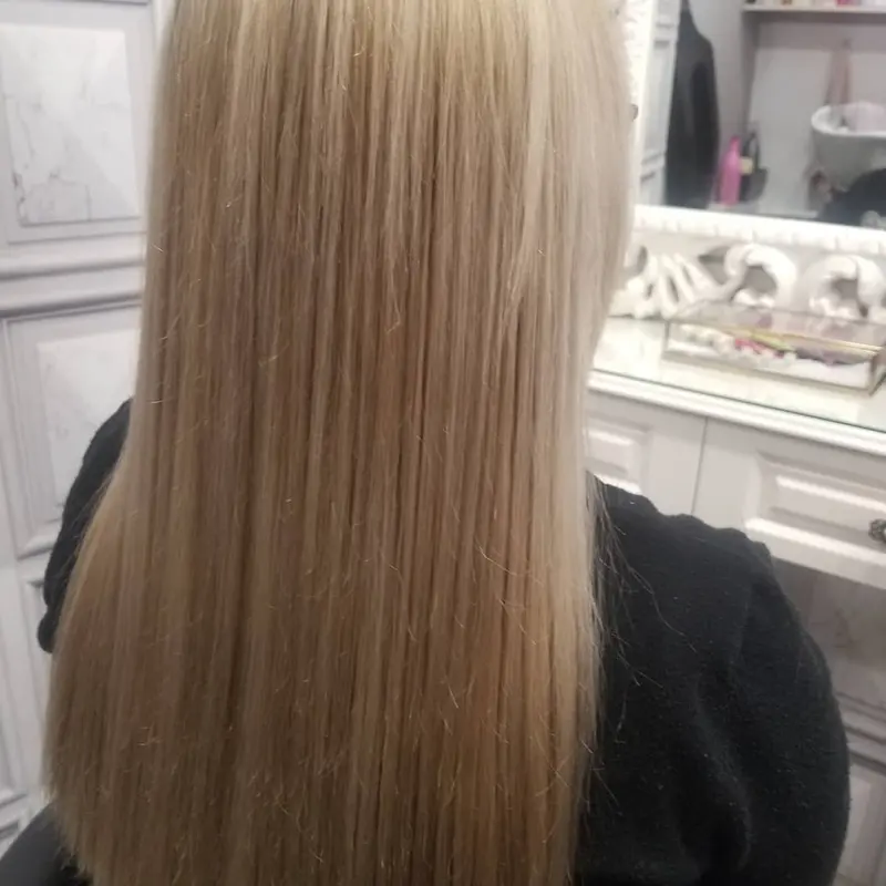 Long, straight, ash-blonde hair seen from behind